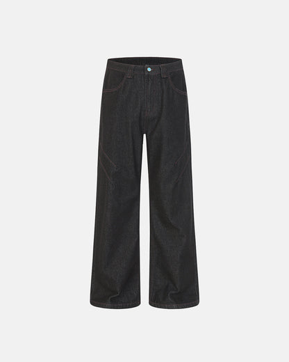 dark raw denim bootcut jeans with contrast stitching and deconstructed seam detail